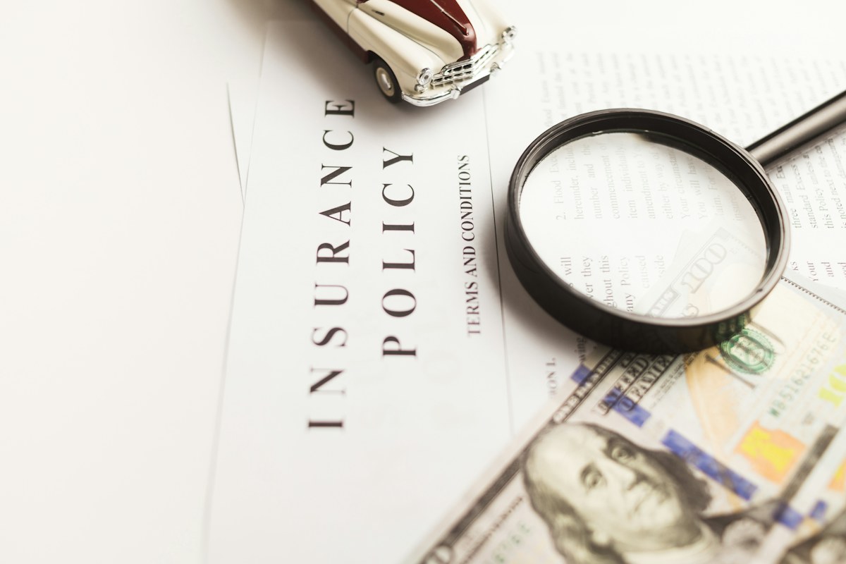 Magnifying glass over policy paperwork